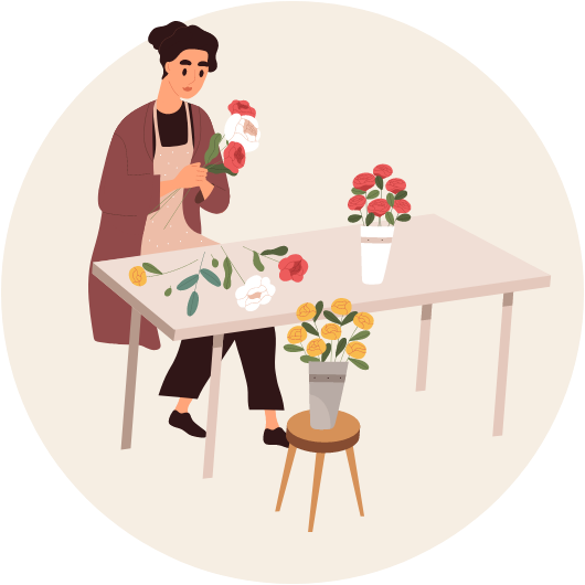 une fleuriste confectionnant un bouquet de fleurs
